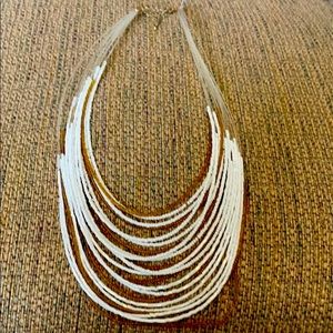 Necklace with gold and white beads